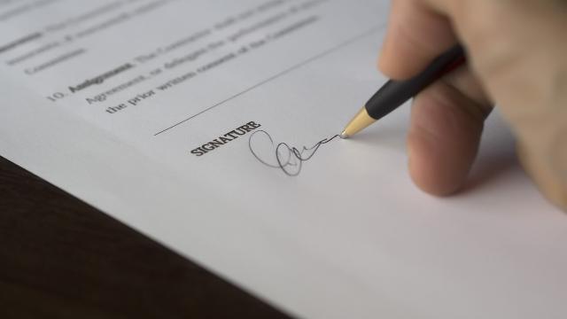 Person signing a contract